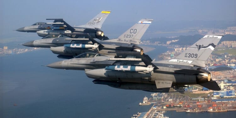 A group of Air National Guard fighter jets flying over South Korea.