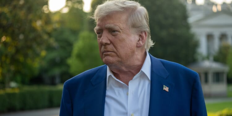 Trump on the White House grounds in afternoon.