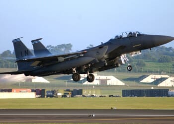 An F-15E Strike Eagle taking off.