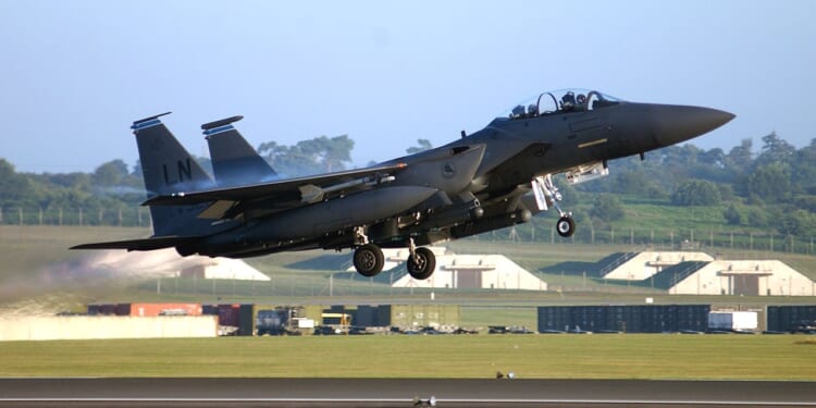 An F-15E Strike Eagle taking off.