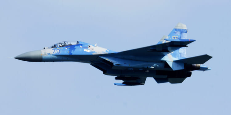 A Ukrainian Sukhoi Su-27 Flanker flies over the flightline during the opening ceremony of exercise Clear Sky 18 at Starokostiantyniv Air Base, Ukraine, Oct. 8, 2018.