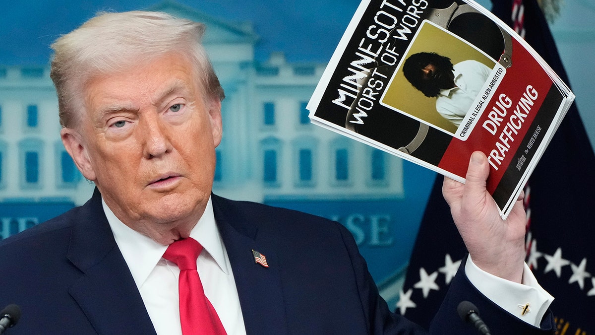 President Donald Trump speaks at a podium during a press briefing at the White House.