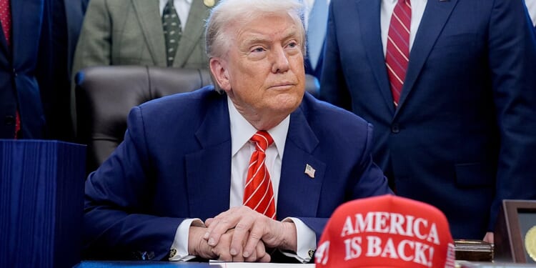 Trump debuts new 'America Is Back!' hat at White House bill signing event
