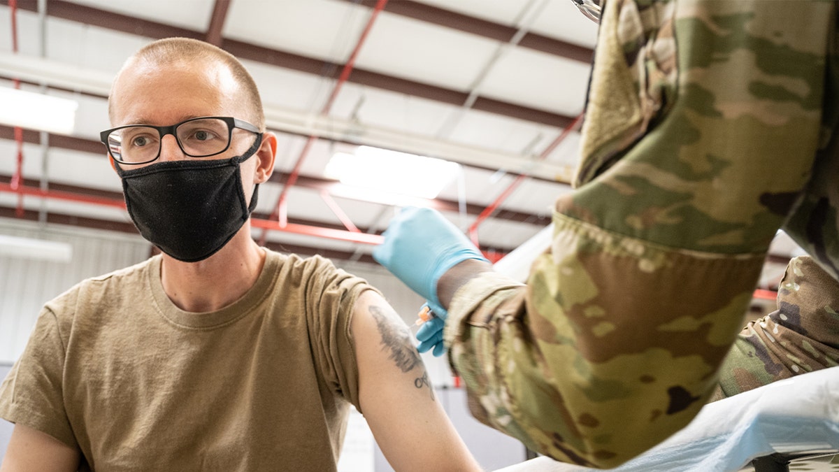 Solider getting COVID shot