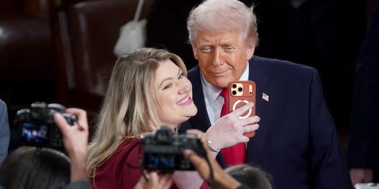 Rep Kat Cammack sits with Dems on left side of House chamber at Trump address