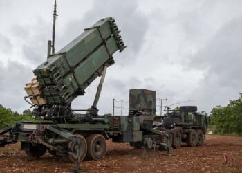 A Patriot missile system with its turret pointed upward.
