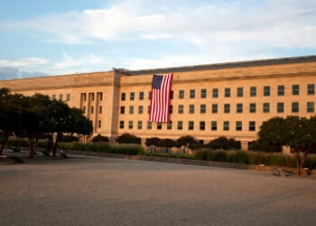 An American flag hanging from the Pentagon.