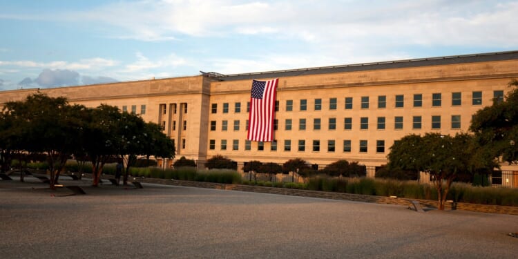 An American flag hanging from the Pentagon.