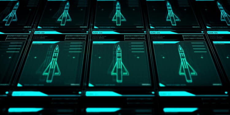 Computer screens displaying illustrations of missiles.