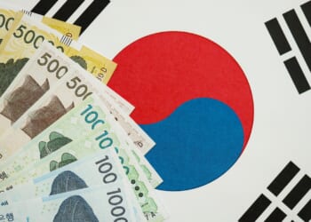 The South Korean won in front of the national flag, highlighting the financial and operational discipline Seoul brings to US nuclear projects. (Shutterstock/Mehaniq)