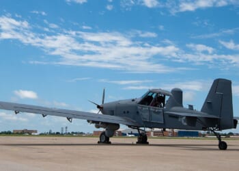 An OA-1K Skyraider II propeller plane at an airfield.