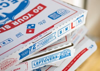 A stack of Domino's pizza boxes.