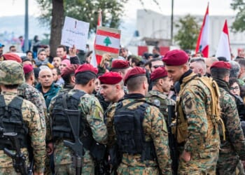 A group of soldiers of the Lebanese Armed Forces standing near each other.