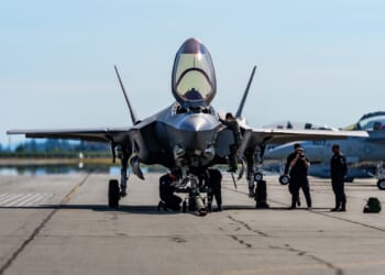 A group of mechanics working on an F-35.