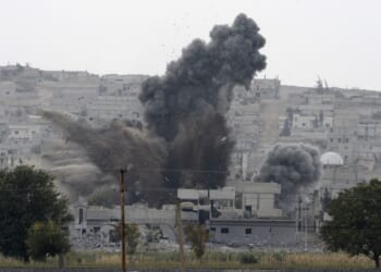 An explosion in a town in northern Syria following an airstrike.
