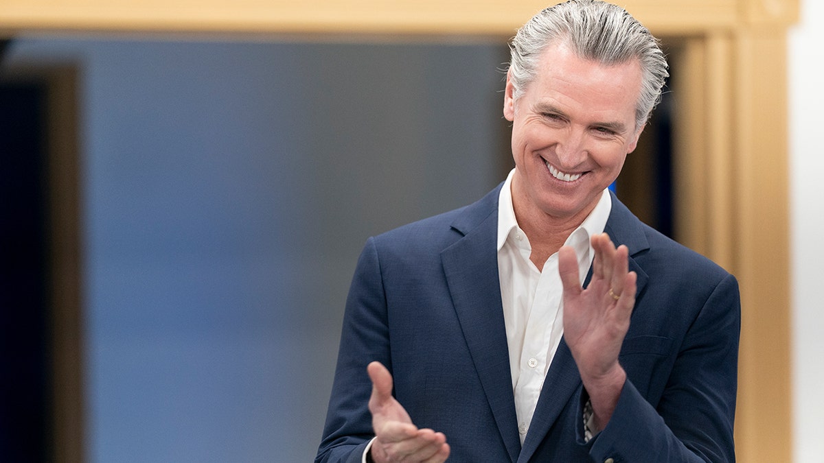 Gavin NEwsom clapping at event in South Carolina for his book