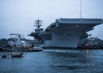 The USS Nimitz leaving her homeport of Bremerton, Washington, for the final time.