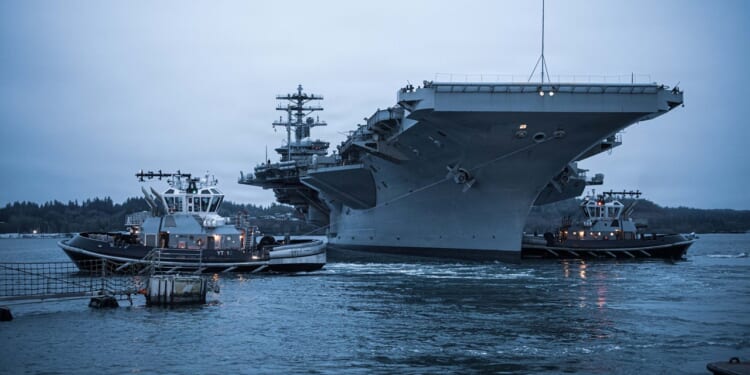 The USS Nimitz leaving her homeport of Bremerton, Washington, for the final time.