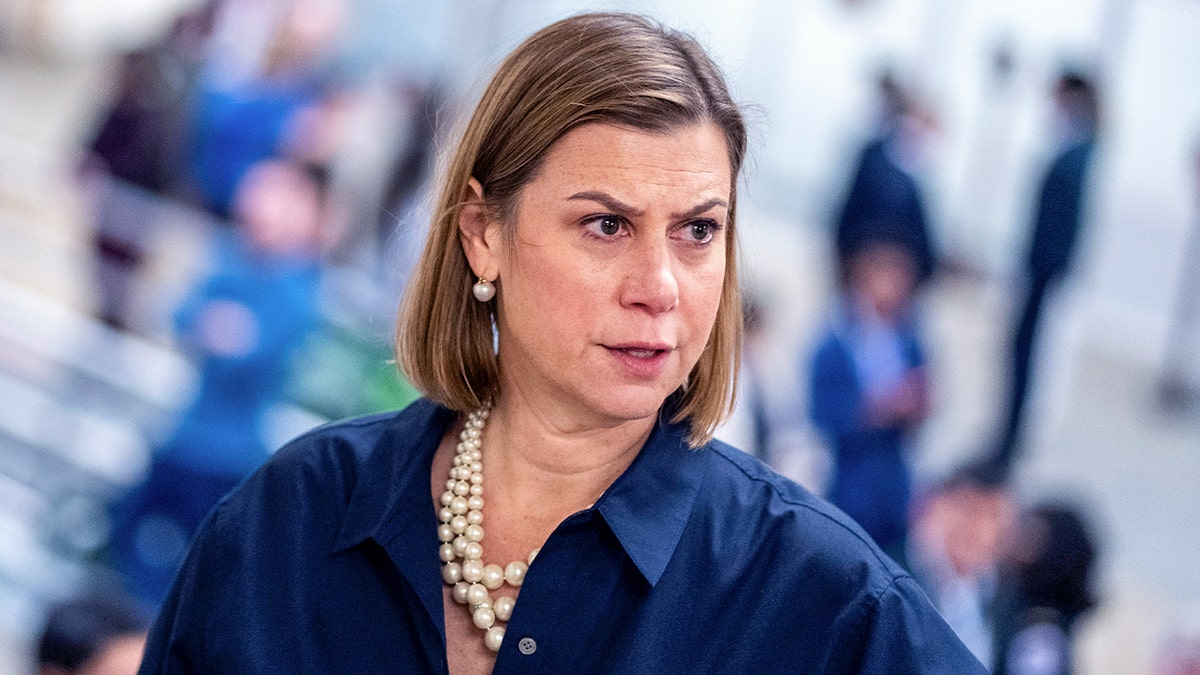 Sen. Elissa Slotkin voting in the U.S. Capitol chamber.