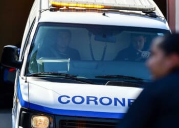 Cleveland woman pleads not guilty to 2 dozen charges after remains of her young daughters were found in buried suitcases