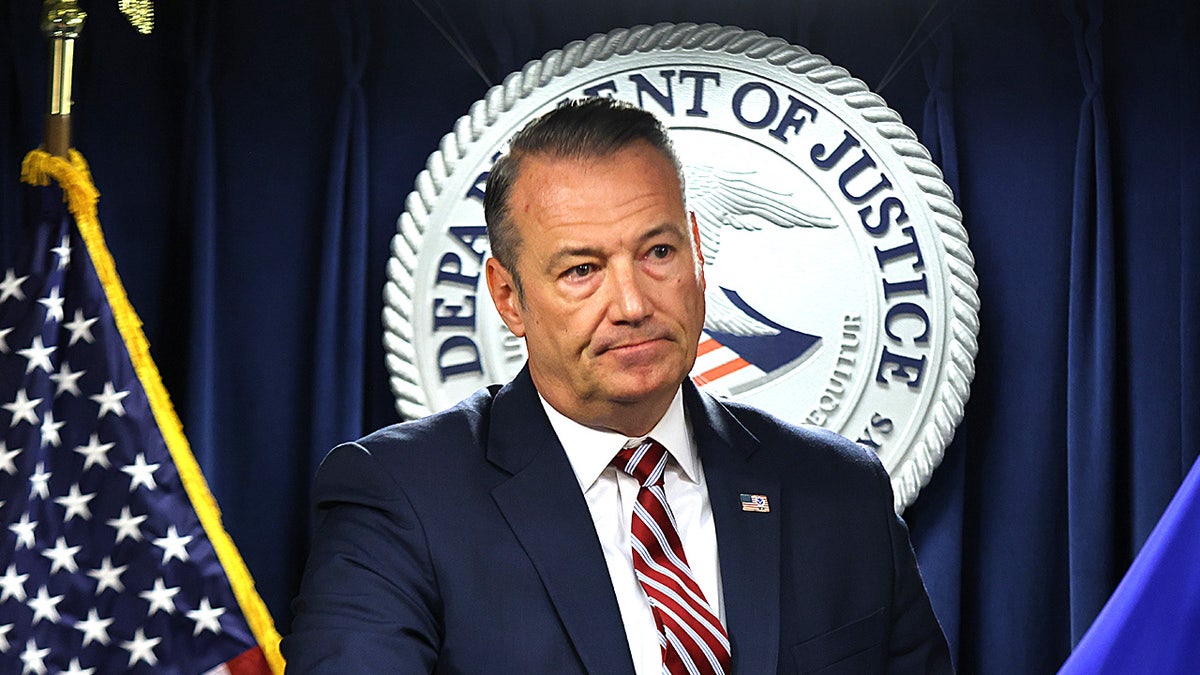 Todd Lyons speaking at a press conference