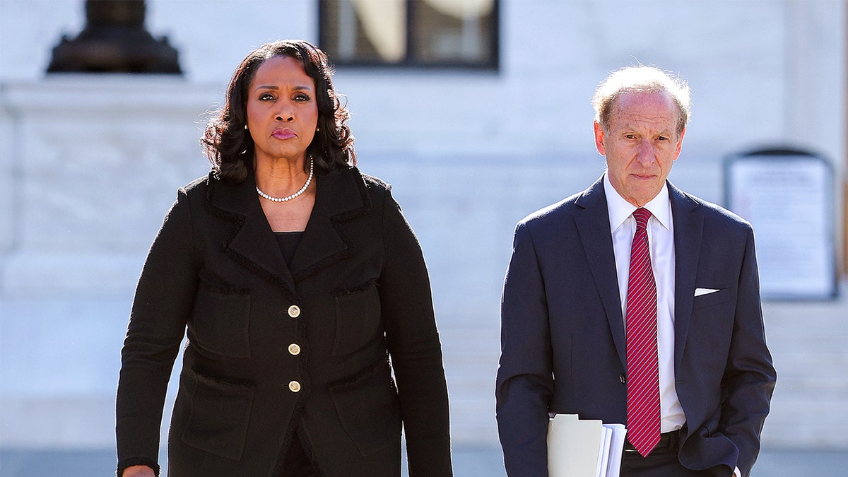 Federal Reserve Governor Lisa Cook and attorney Abbe Lowell leave the U.S. Supreme Court today in Washington, D.C. (Getty Images)