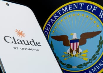 A phone displaying the Anthropic logo next to the seal of the Department of Defense.