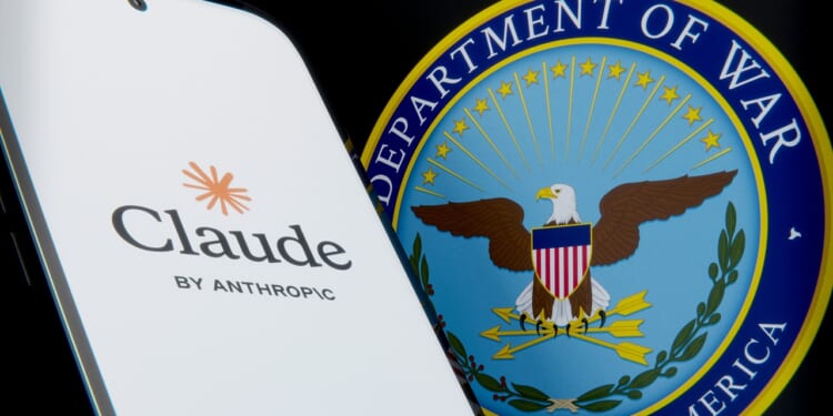A phone displaying the Anthropic logo next to the seal of the Department of Defense.