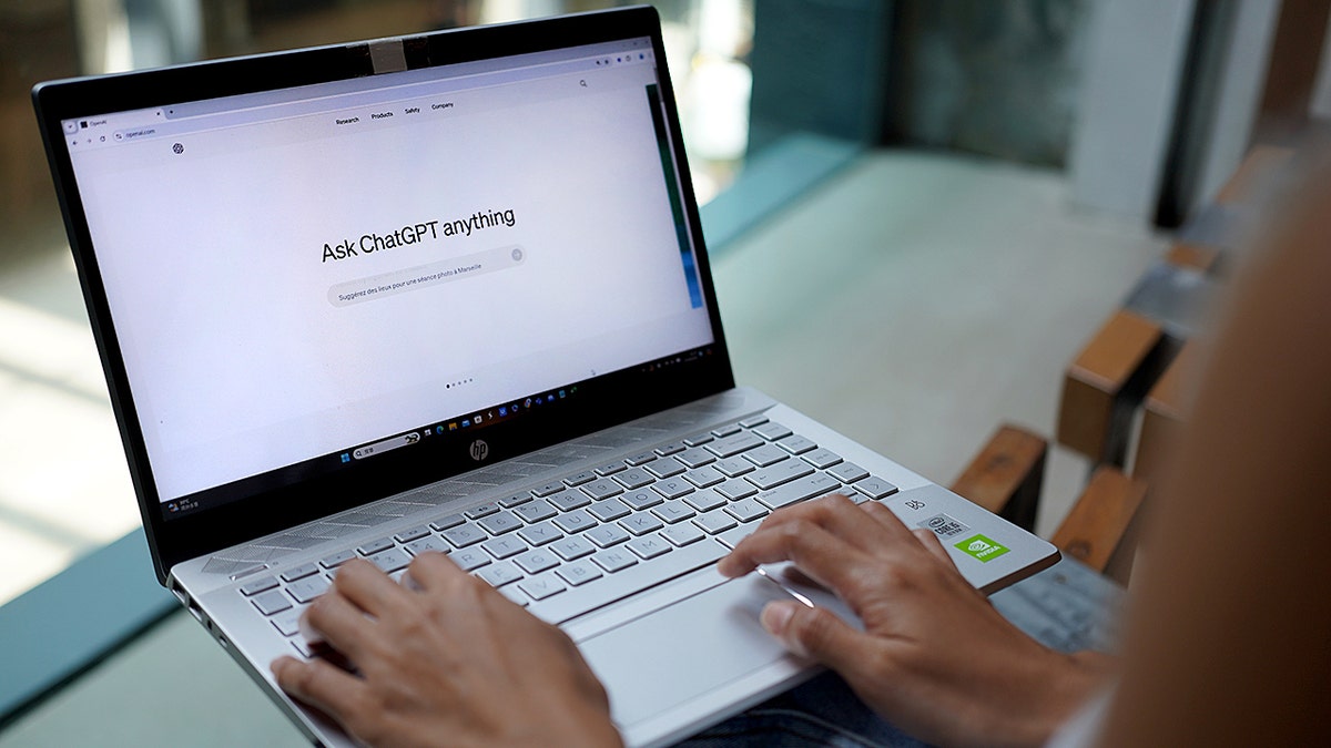 Hands of a person typing on a computer on ChatGPT.