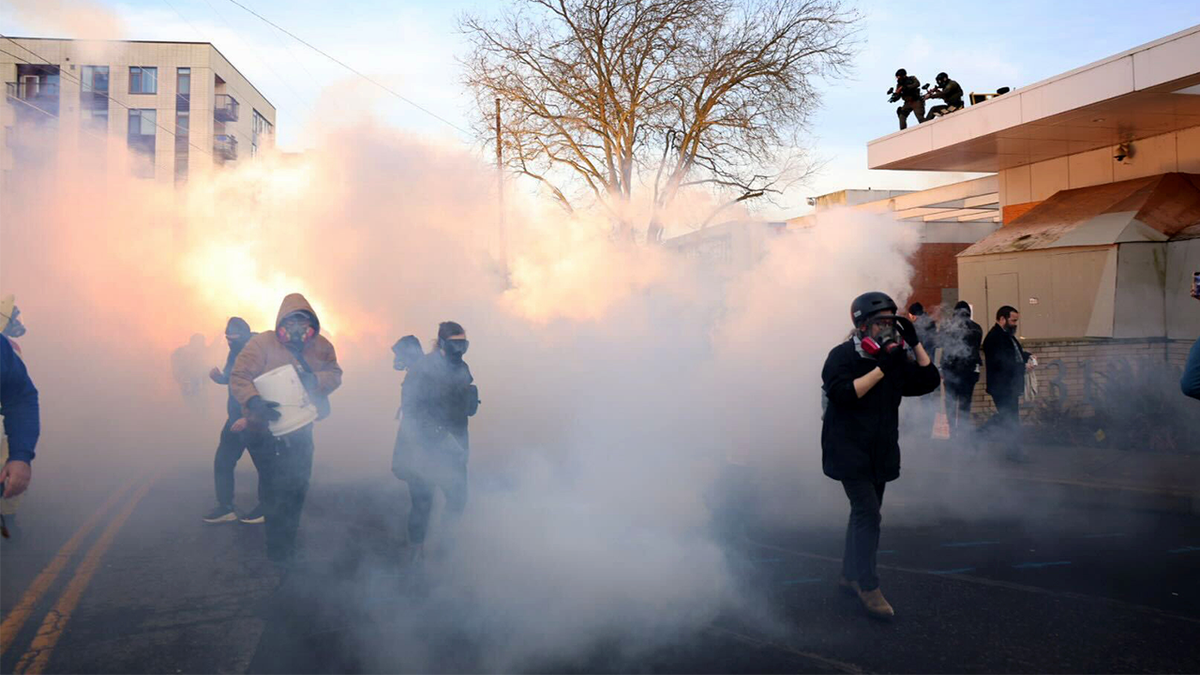 Federal agents lobbed tear gas and flash bangs at protesters