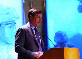 Michael Obadal, Under Secretary of Defense, delivering remarks.