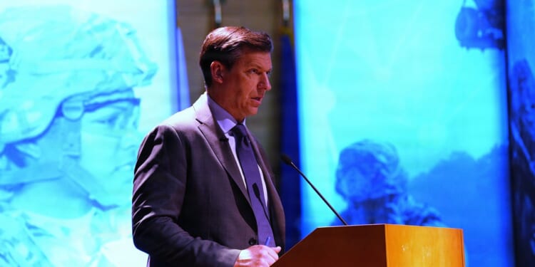 Michael Obadal, Under Secretary of Defense, delivering remarks.