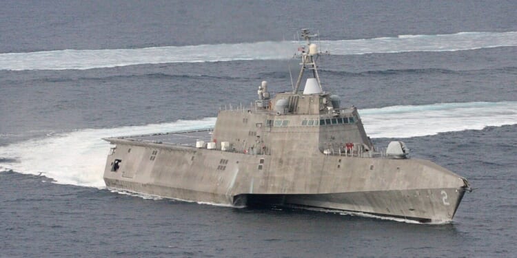 The USS Independence, a Littoral Combat Ship, turns in the water.