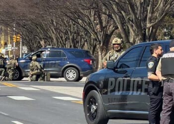 Baltimore Officer, Barricaded Suspect Shot in Gunfire Exchange