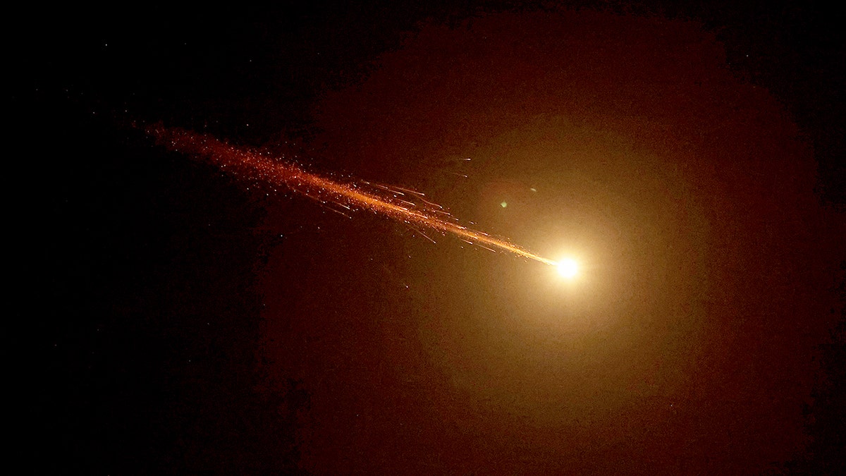 Rocket trails streaking across the sky above the coastal city of Netanya.