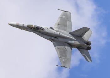 A Finnish F-18 fighter jet flying during an airshow.