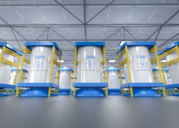 A row of small modular reactor units in a factory.