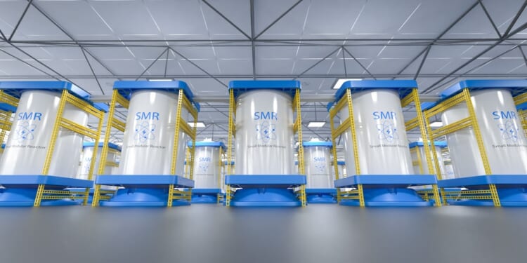 A row of small modular reactor units in a factory.