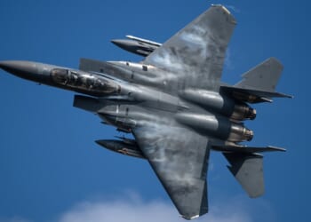 An F-15E Strike Eagle fighter jet in flight.