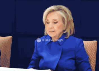 Hillary walking out of deposition