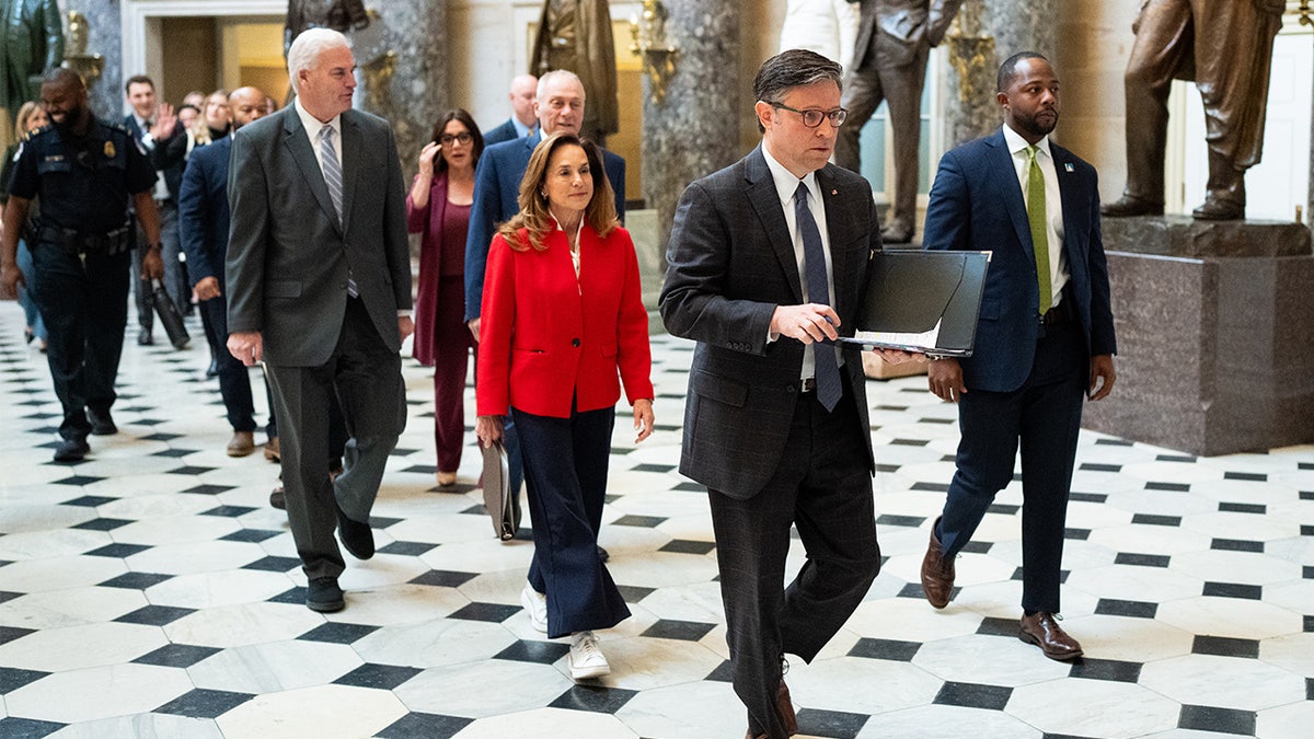 House GOP leaders walk to a press conference