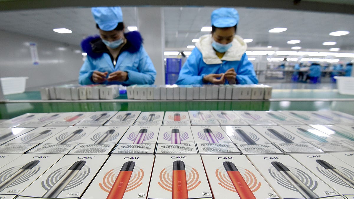 Workers package e-cigarettes.