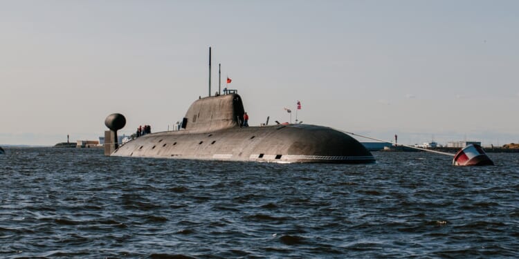 A Russian submarine at sea in poor weather.