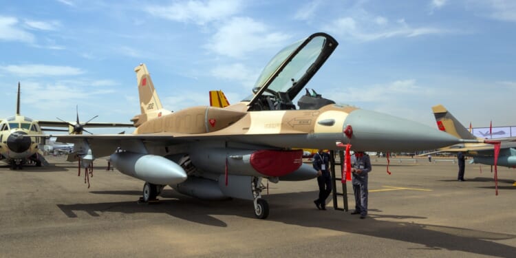 A Moroccan Air Force F-16 on the ground at an airfield.