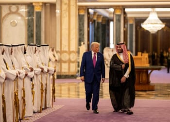 President Donald Trump and Crown Prince Mohammed bin Salman walking side by side in Riyadh.