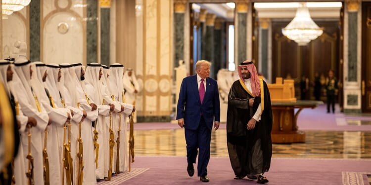 President Donald Trump and Crown Prince Mohammed bin Salman walking side by side in Riyadh.
