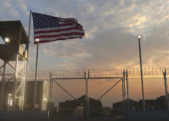 An American flag flies above a US military installation.