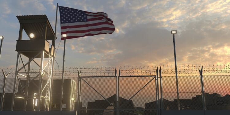 An American flag flies above a US military installation.