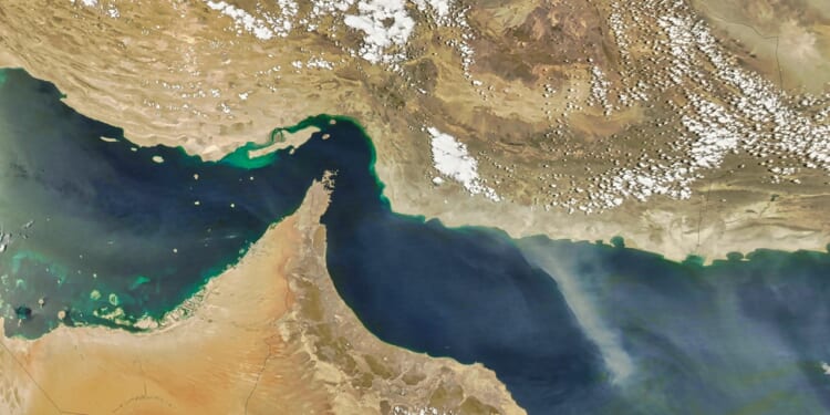 A view from space of the Persian Gulf and Gulf of Oman, with the Strait of Hormuz at the center.