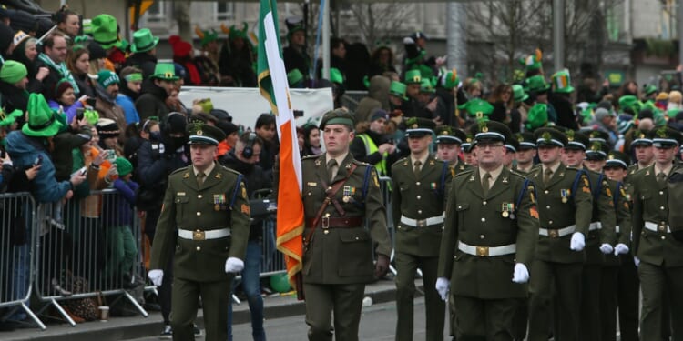 A group of Irish soldiers marching.